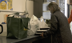 Volunteer preparing meals for students at the BaNC.